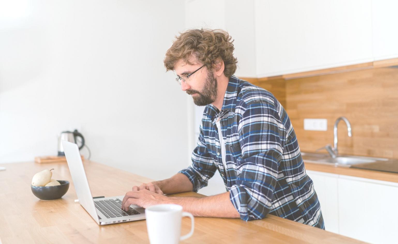 Professional reviewing complex financial models on multiple screens